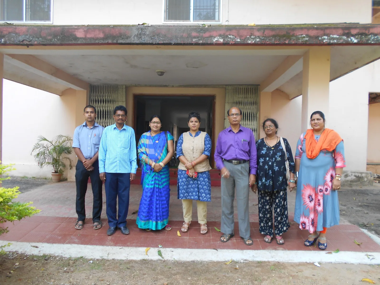 MIRROR team members standing together outside a public building