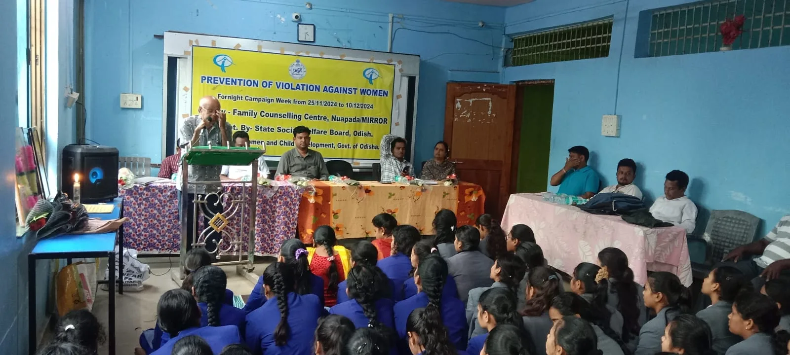 Speaker addressing a prevention of violence against women programme